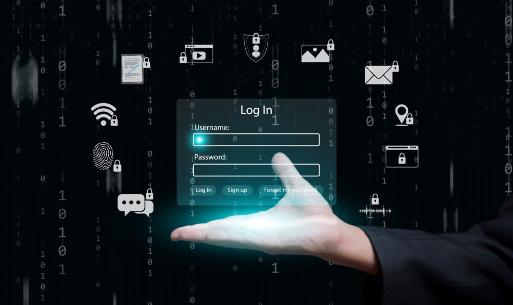 Hand mit Log-In Fenster und darüber schweben Internetservice Symbole