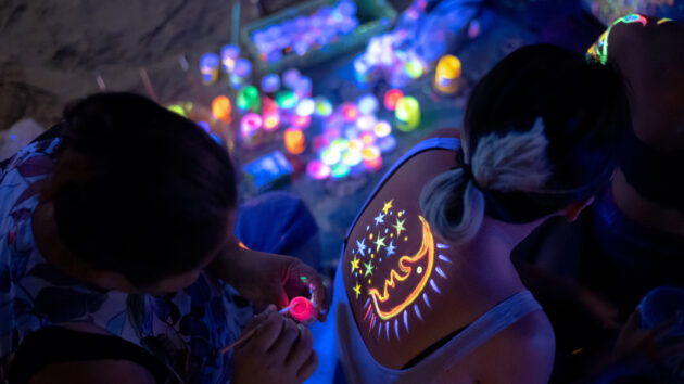 Tourists With Neon Makeup Which Made of Fluorescent Paint in Thailand